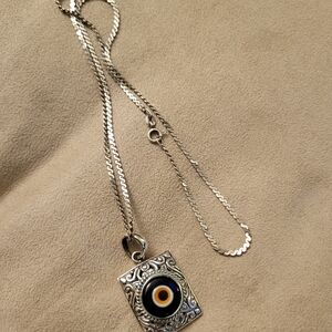 Silver Pendant Necklace with Black and Gold Accents